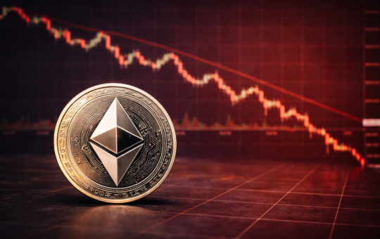 An Ethereum coin placed in front of a red downward cryptocurrency price chart showing a market decline.